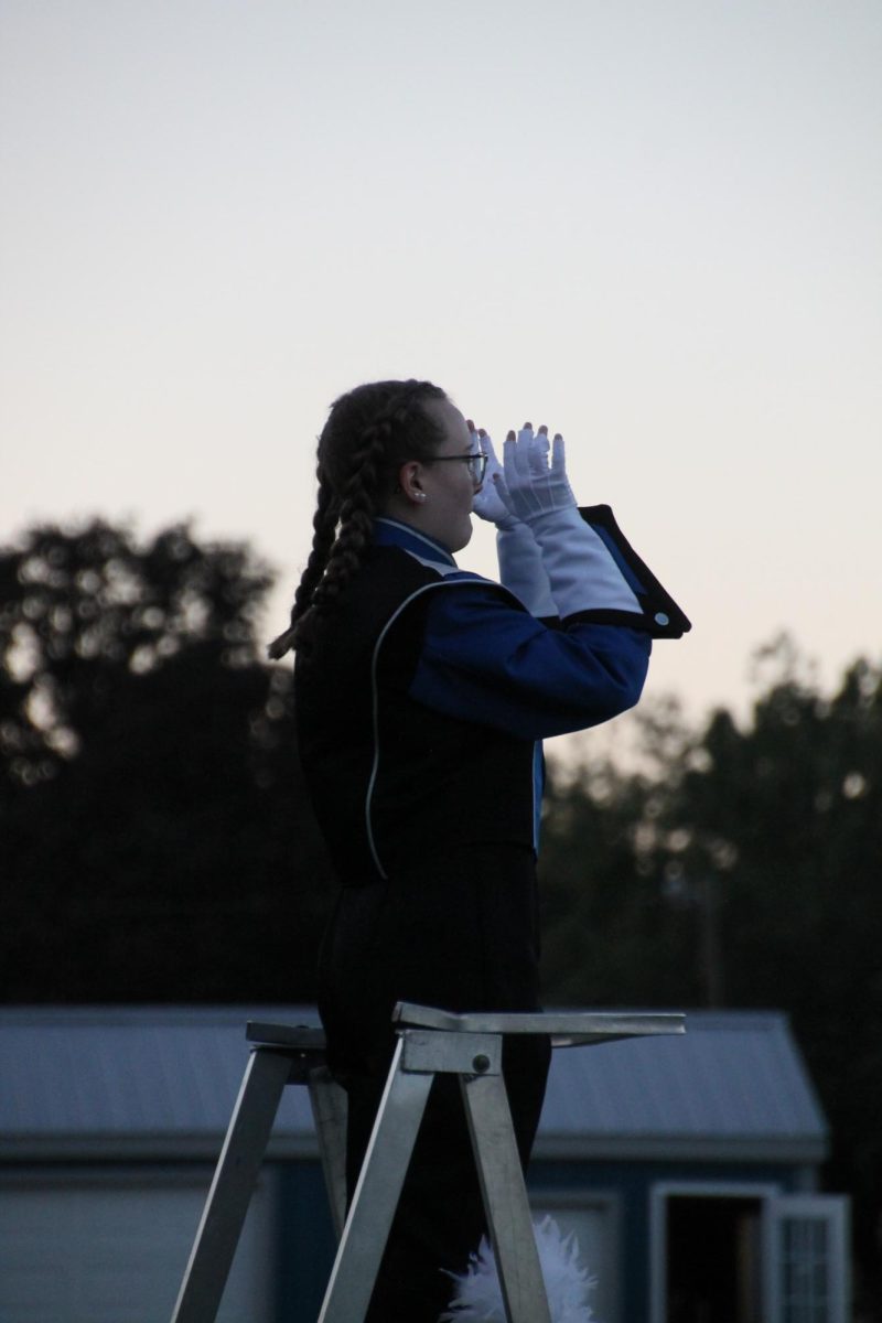 Senior Drum Major Meagan Crup sets the pace for the flashback set list. 