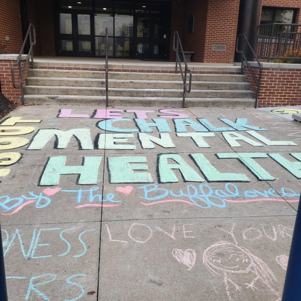 The Buffaloves, Newports Kindness Club, created messages of positivity in front of the high school on Oct. 3, 2023