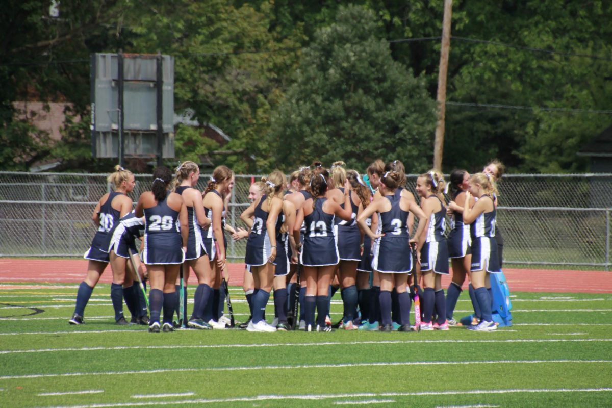 The Field Hockey team gathers after a PeCo tournament game.