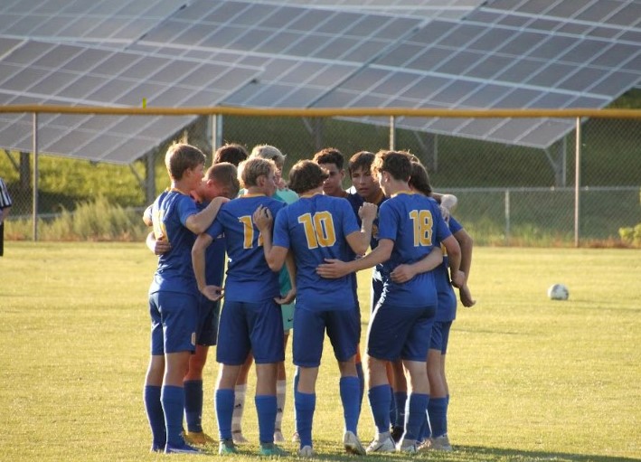 The soccer team huddled in during their game against Juniata on Aug. 31