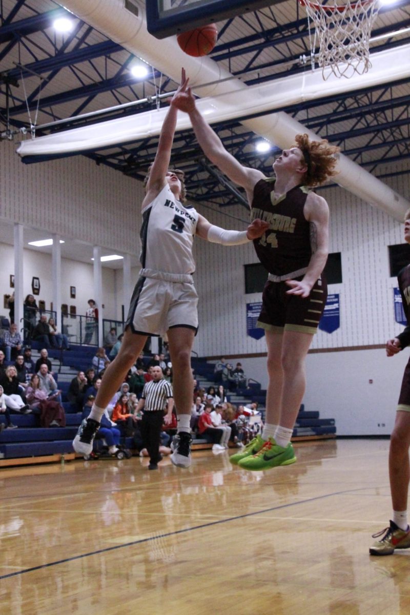 Freshman Landon Zaring puts up a layup against a Millersburg Area player.