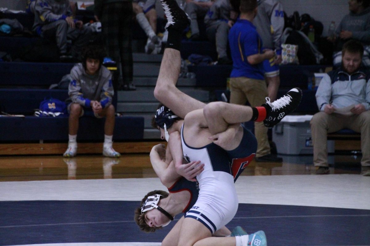 Freshman Jameson Peters stacks a Juniata wrestler behind his shoulders at the Newport Holiday Tournament.