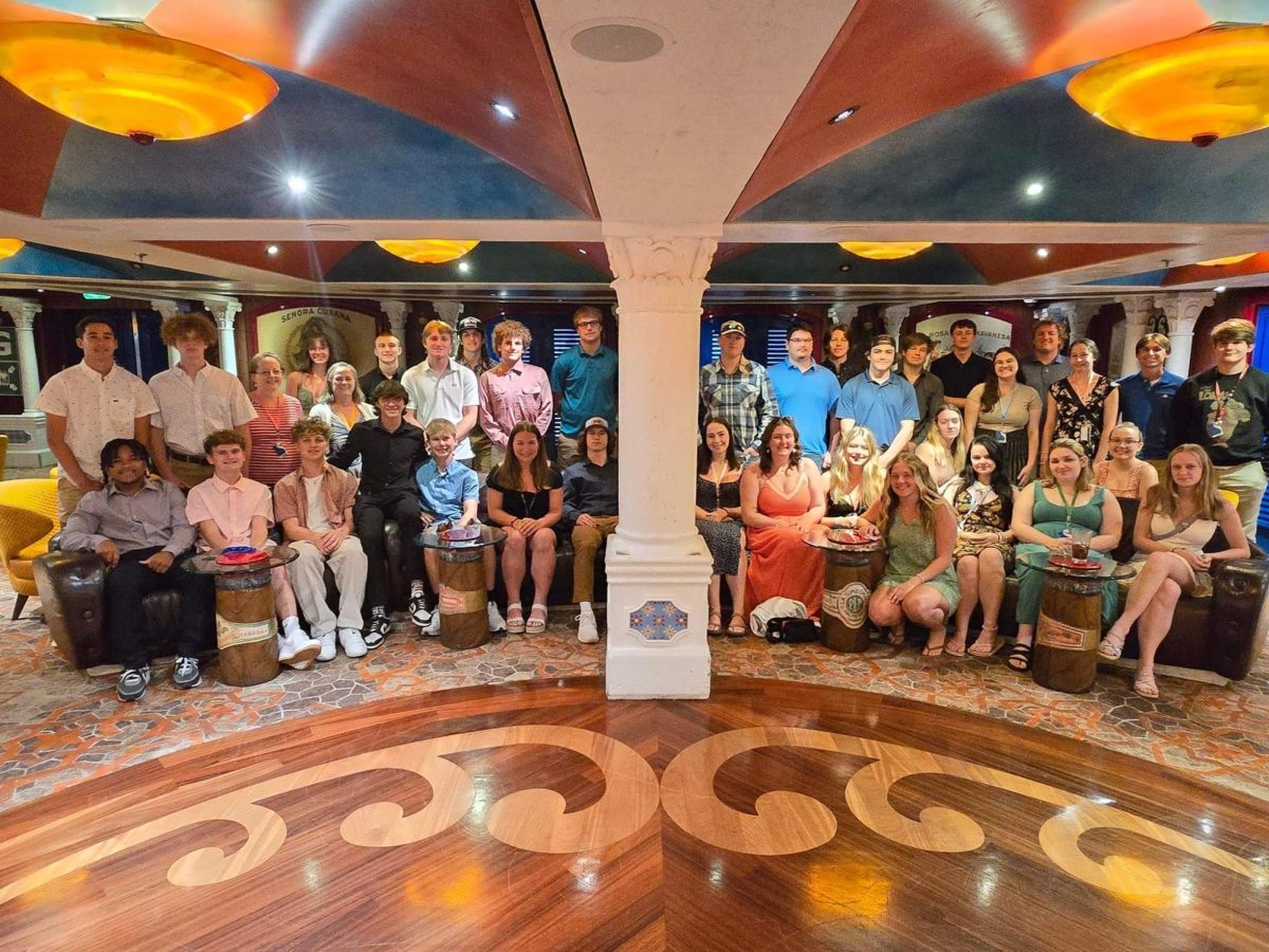 The senior class dressed up for their final group dinner on the senior class trip cruise.