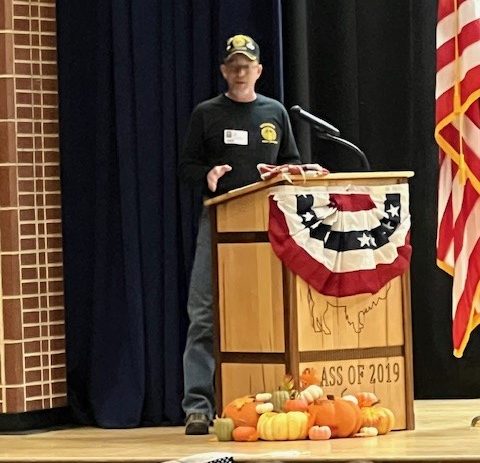 Sergeant Fisher speaks at Veterans Day Assembly