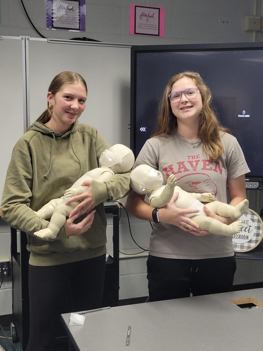 Sophomore Gabriella Benner and freshman Eliza Benner at the CPR training course