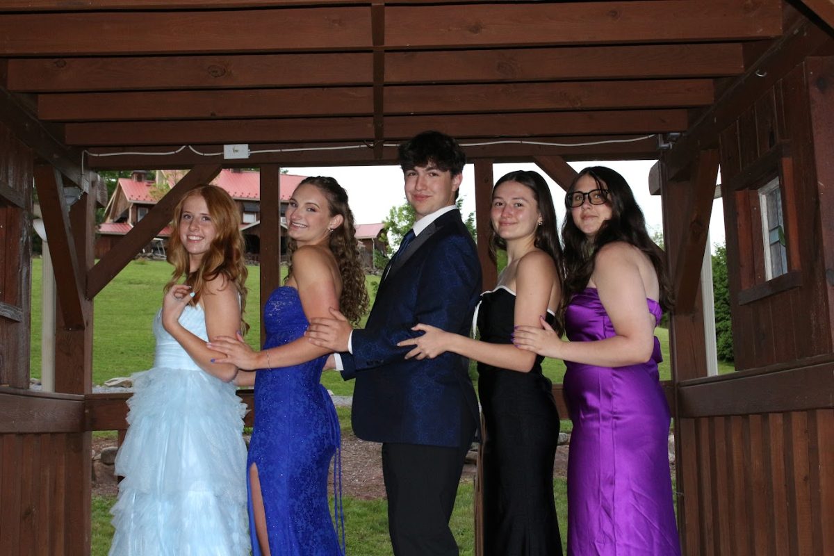 Mary Jones, Christina Eshelman, Zachariah Mouhssin, Kathryn Ebling, and Claire Umland assemble on the footbridge for a group photo.
