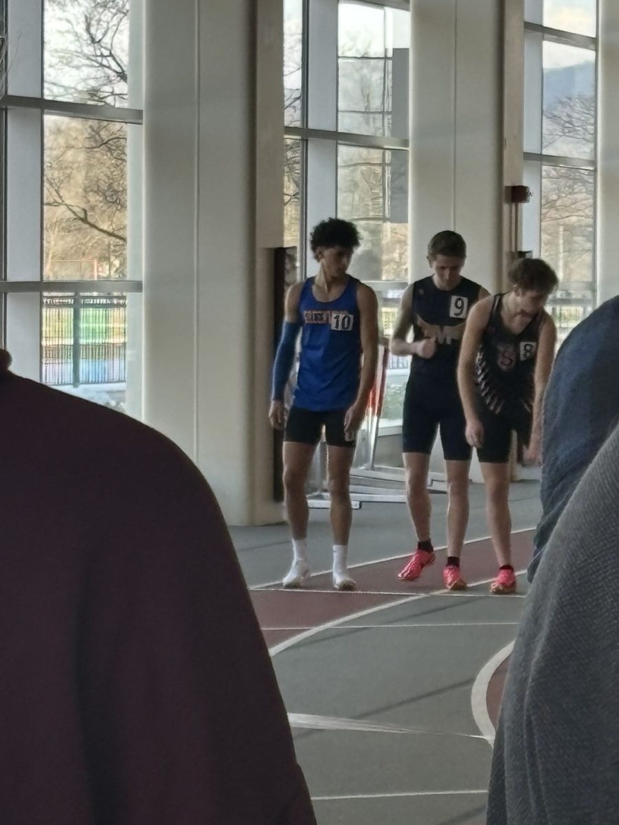 Indoor track members get ready to run the 800M