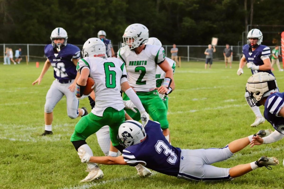 Sophomore Christopher Imler attempting a tackle against Juniata Valley.