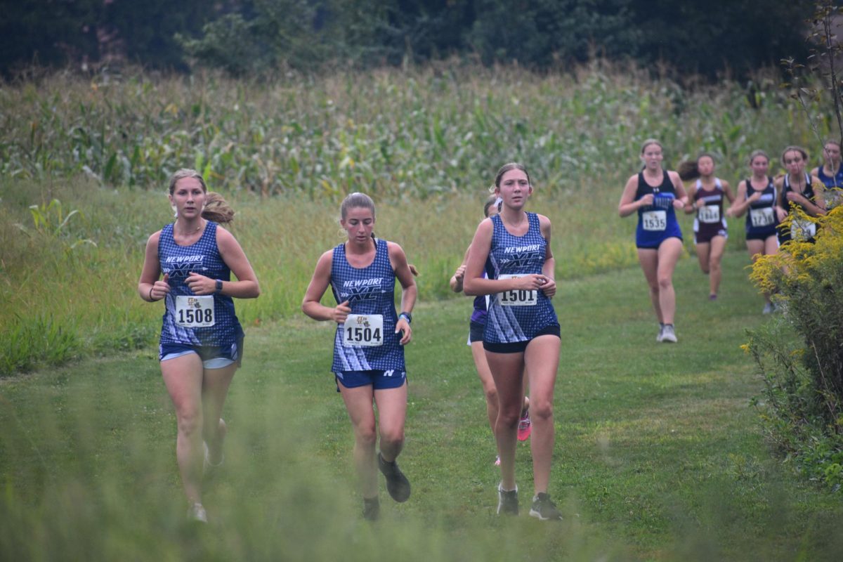 Now junior Gabby Benner (right) runs alongside previous seniors Gracyn Shutt (left) and Megan Foltz (middle) at the PTXC Kutztown University High School Invitational last fall.
