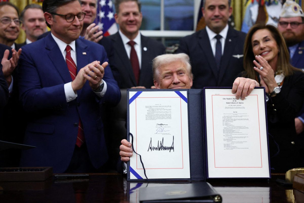 U.S. President Donald Trump signs the funding bill to end the U.S. government shutdown, at the White House. REUTERS/Kevin Lamarque