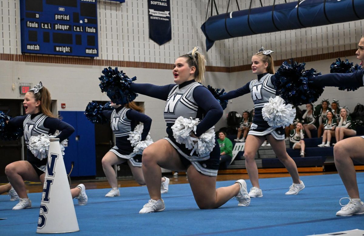 Senior cheer captain Isis McNaughton front and center during the teams routine in the Perry County championship.