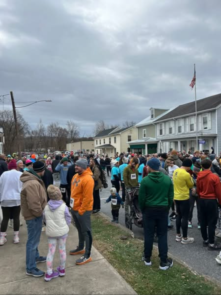 Before the feast, runners gather for the annual Turkey Trot event through downtown Newport.
