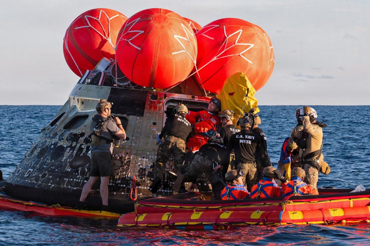 NASA Astronaut Reid Wiseman, Artemis II mission commander, exits the Orion crew module to join the three other crew in a raft, before transiting to the U.S. Navy ship USS John P. Murtha in the Pacific Ocean off the coast of California, U.S. April 10, 2026. NASA's Artemis II mission sent four astronauts on a flight around the moon in the Orion space capsule, which splashed down after the ten day journey.  U.S. Navy/Mass Communication Specialist David Rowe/Handout via REUTERS