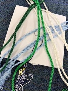Seniors received caps, gowns, and cords today after the awards assembly.